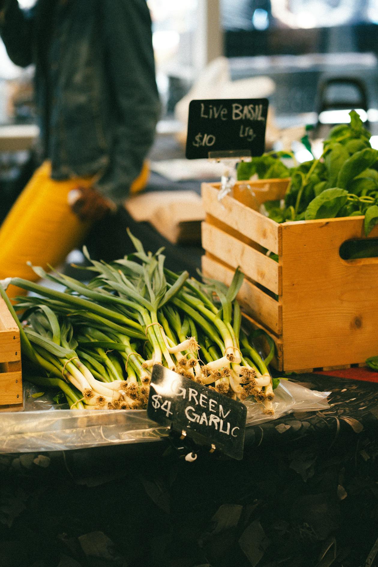 Green garlic at a farmers market stall